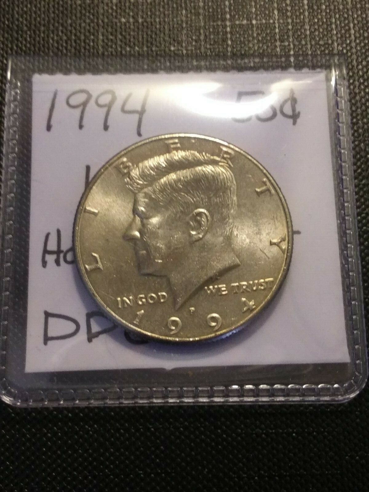 1994 Kennedy half dollar Doubled Die Obverse error showing doubling on LIBERTY inscription