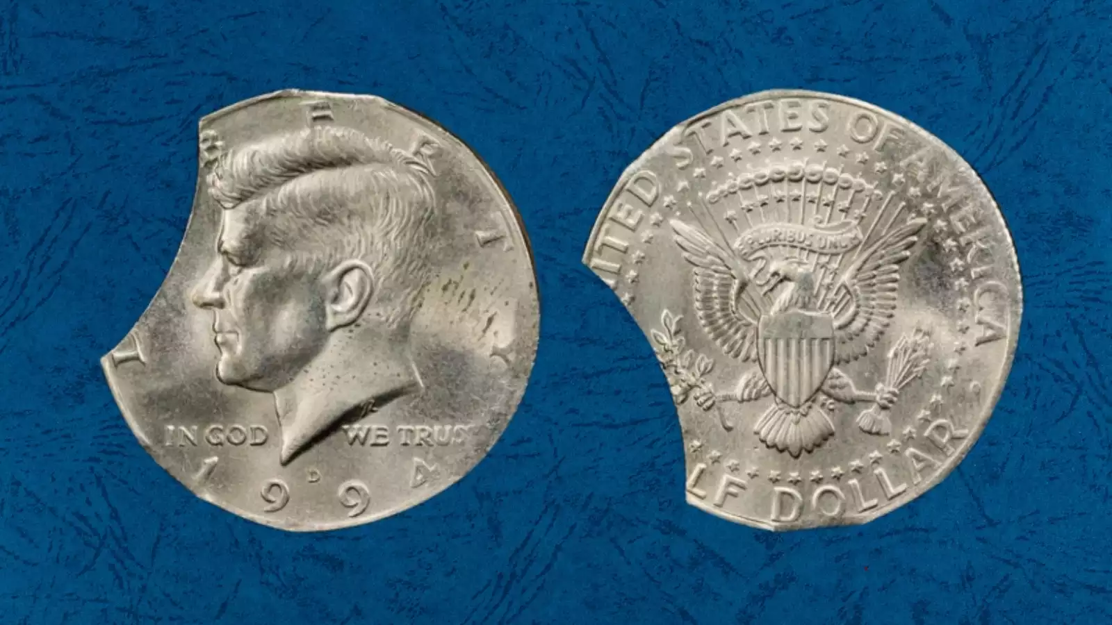 1994 Kennedy half dollar clipped planchet error showing curved bite of missing metal from the coin edge